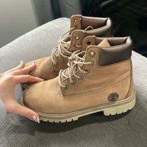Tan Timberland boots with metallic detail